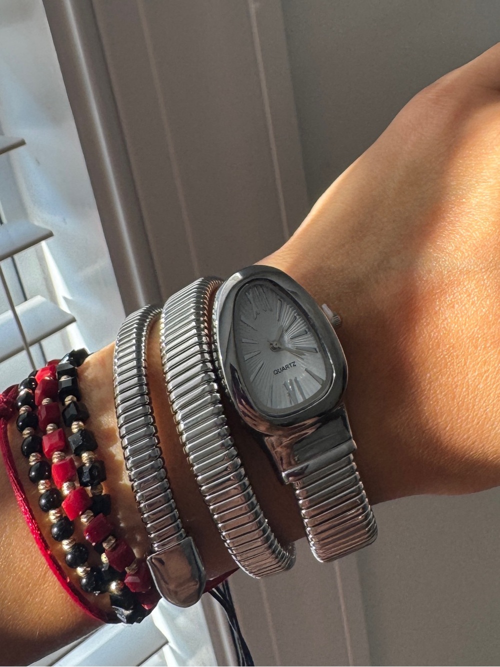 Silver Coil Wrap Watch with Red and Black Bracelet Details